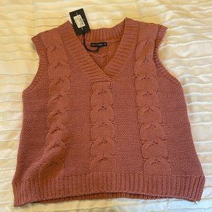 Brand new never worn knitted pink sleeveless sweater. Great condition!